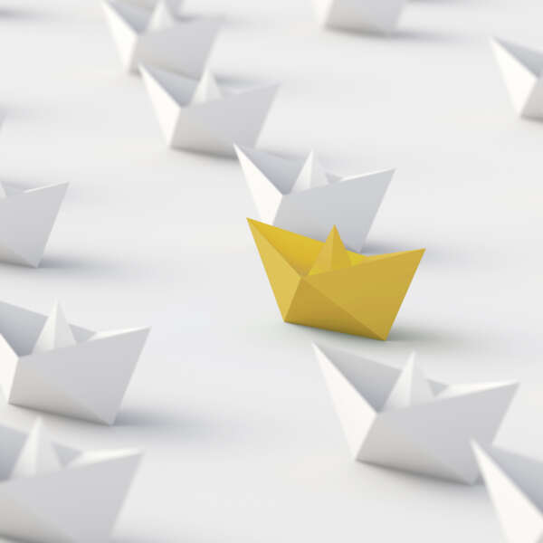 Leadership concept, blue leader boat, standing out from the crowd of white boats, on white background. 3D Rendering